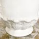Vintage covered pot in white earthenware molded with lions and friezes