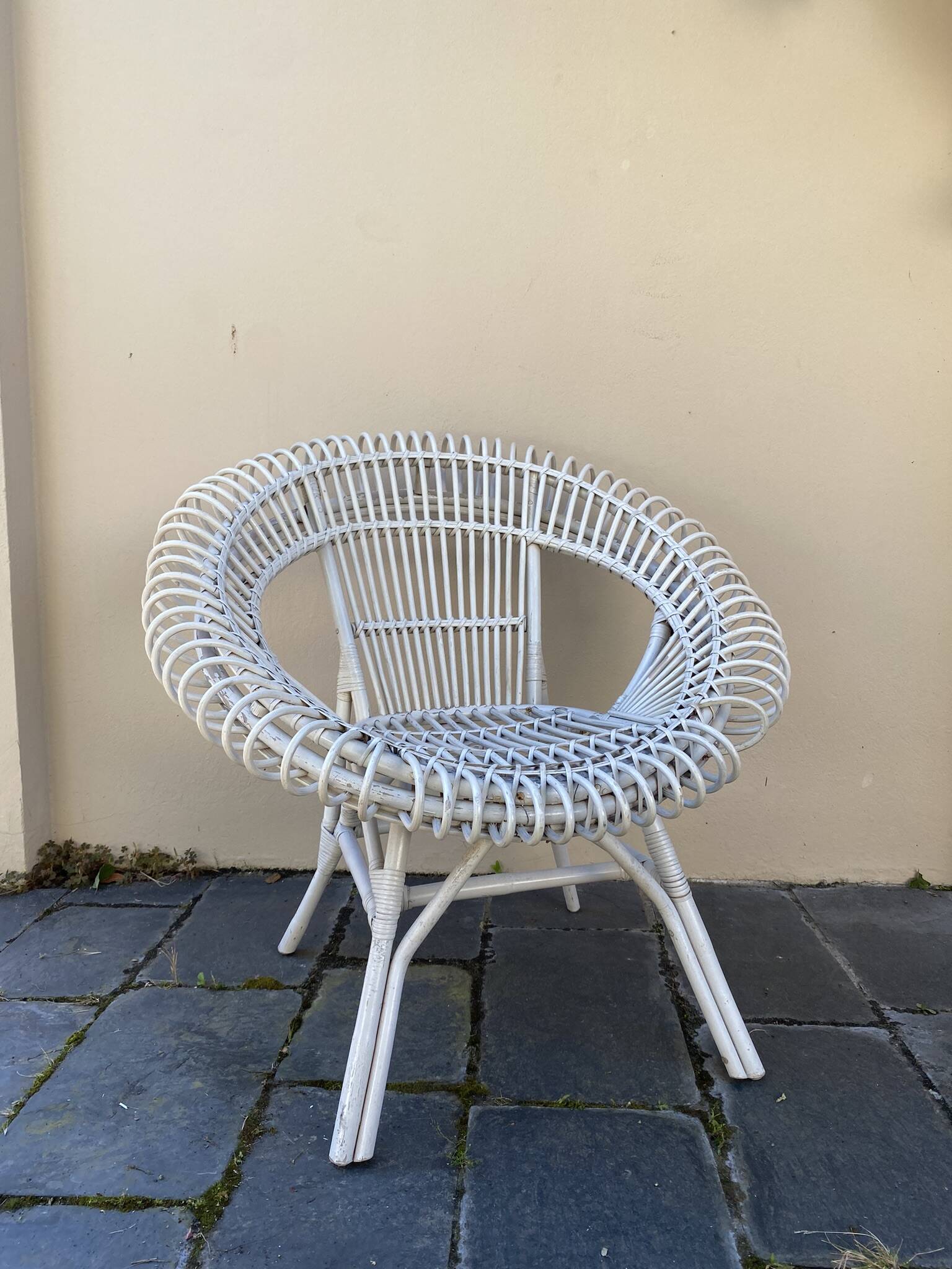 Vintage white rattan armchair