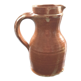 Signed pitcher in yellow ochre sandstone