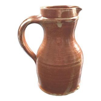 Signed pitcher in yellow ochre sandstone