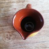 Small two-tone brown-yellow terracotta pitcher
