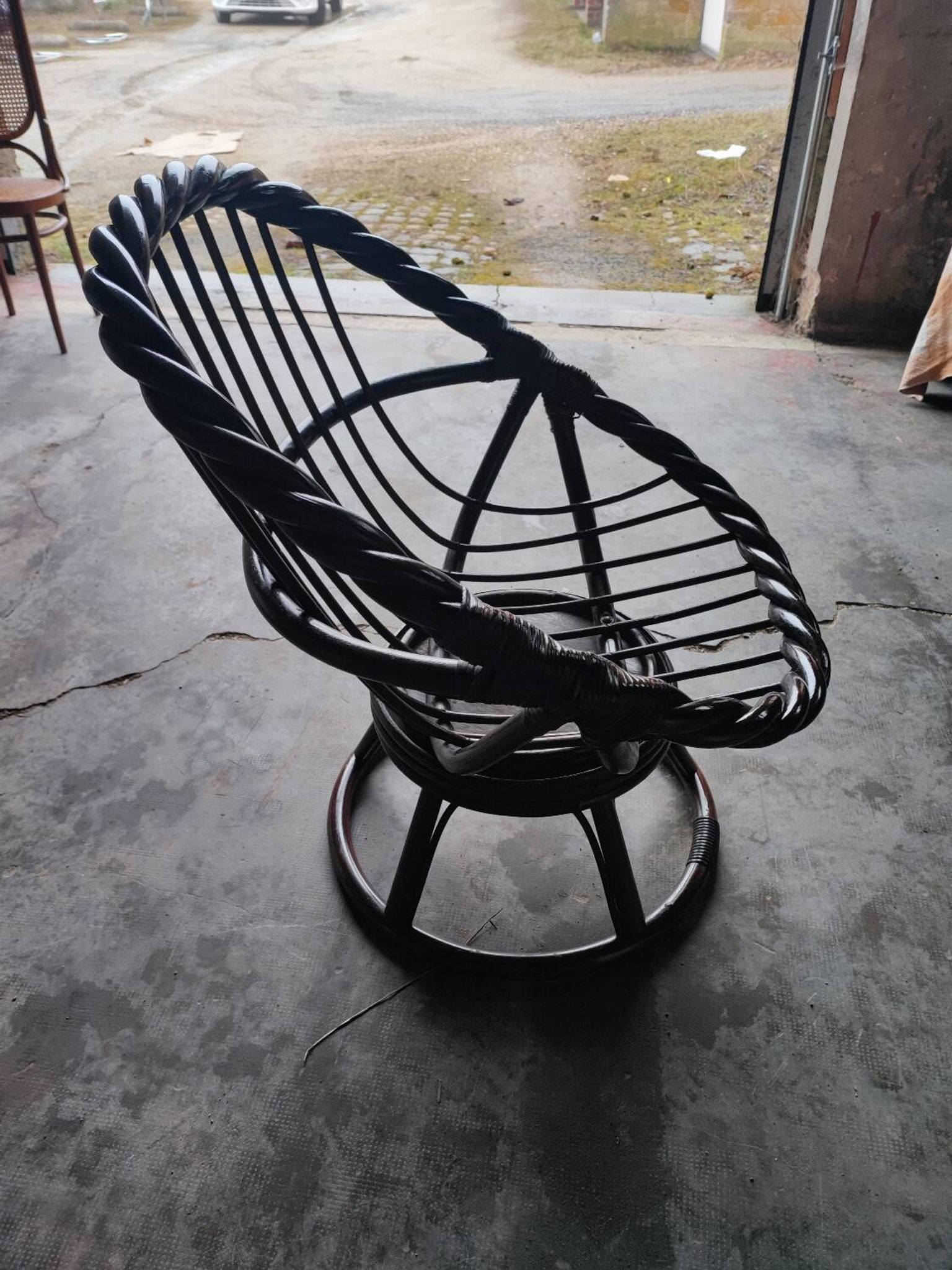 Swivel rattan love seat