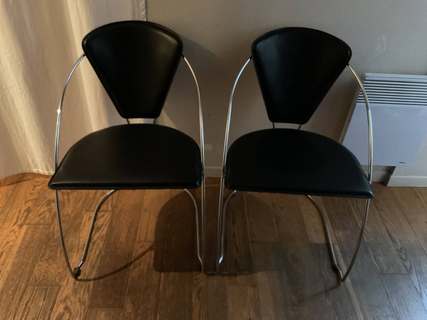 Two vintage steel and leather FIL chairs