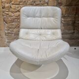 Fauteuil pivotant en cuir patiné gris