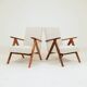 Pair of Mid-Century Modern armchairs in solid beech and boucle fabric.