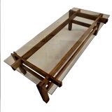 Glass coffee table with a wooden frame.