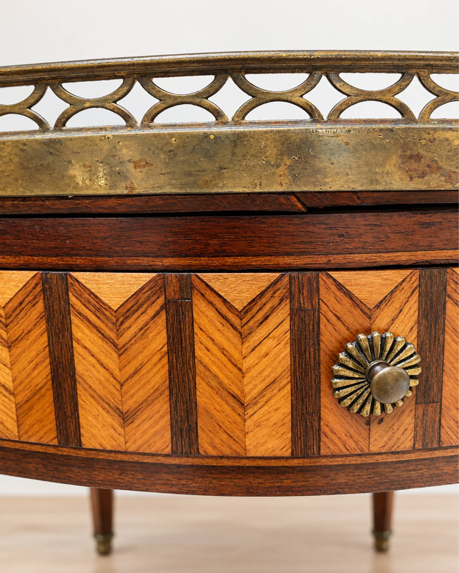 Bouillotte table in Louis XVI style with marquetry, marble, and brass.