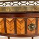 Bouillotte table in Louis XVI style with marquetry, marble, and brass.