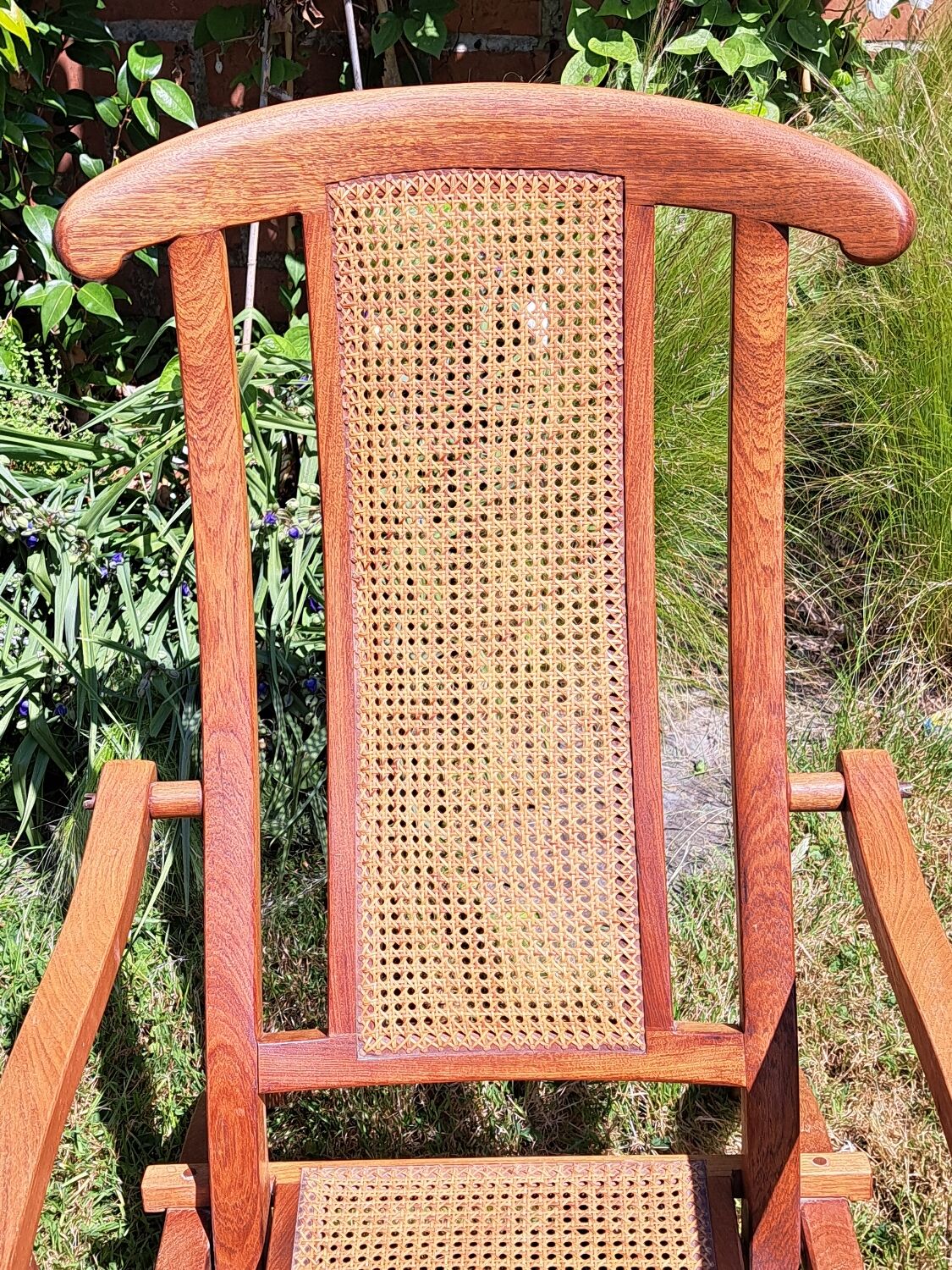 Pair of teak and cane deckchairs