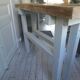 Vintage workbench with pearl gray patinated base and wooden top