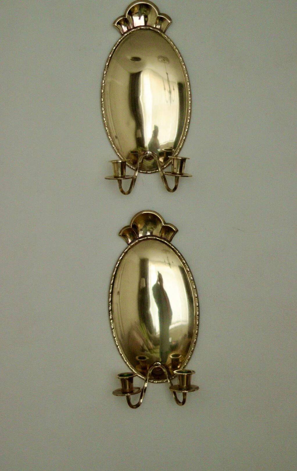Pair of Swedish brass wall sconces from the mid-century.
