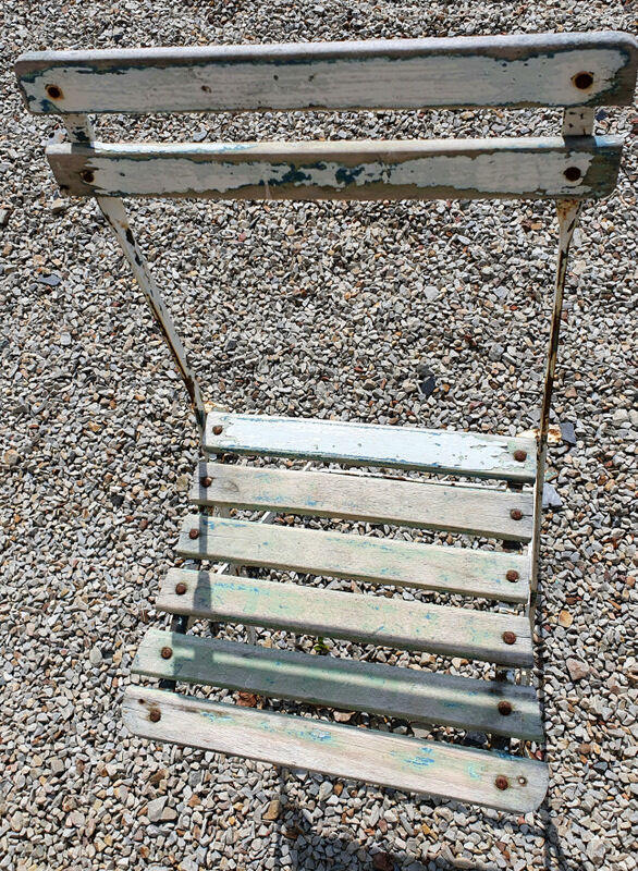 Wooden slatted garden chair with wooden slats and iron foot