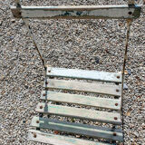 Wooden slatted garden chair with wooden slats and iron foot