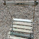 Wooden slatted garden chair with wooden slats and iron foot