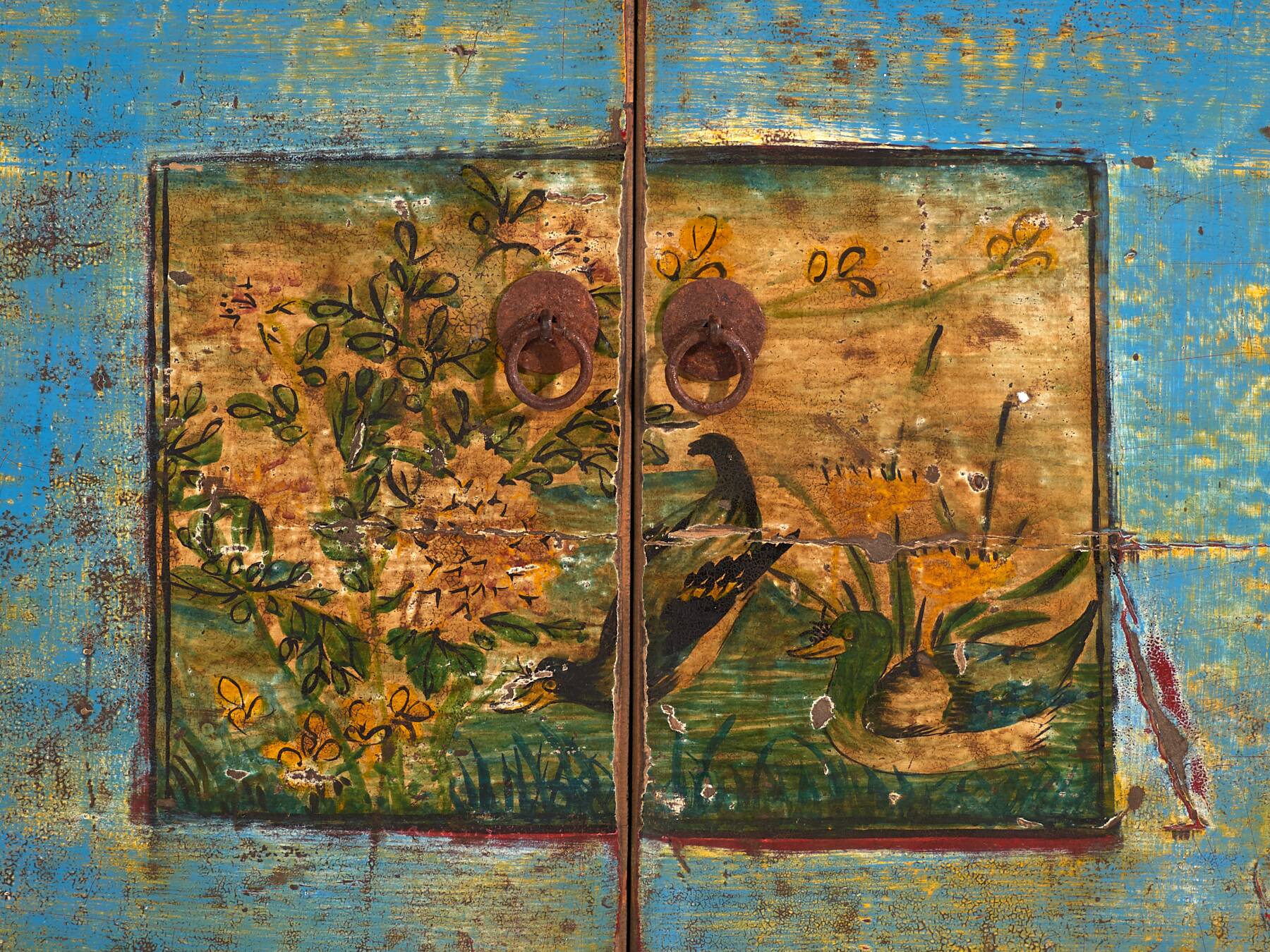 Old wooden entrance buffet in blue and yellow tones (circa 1920).
