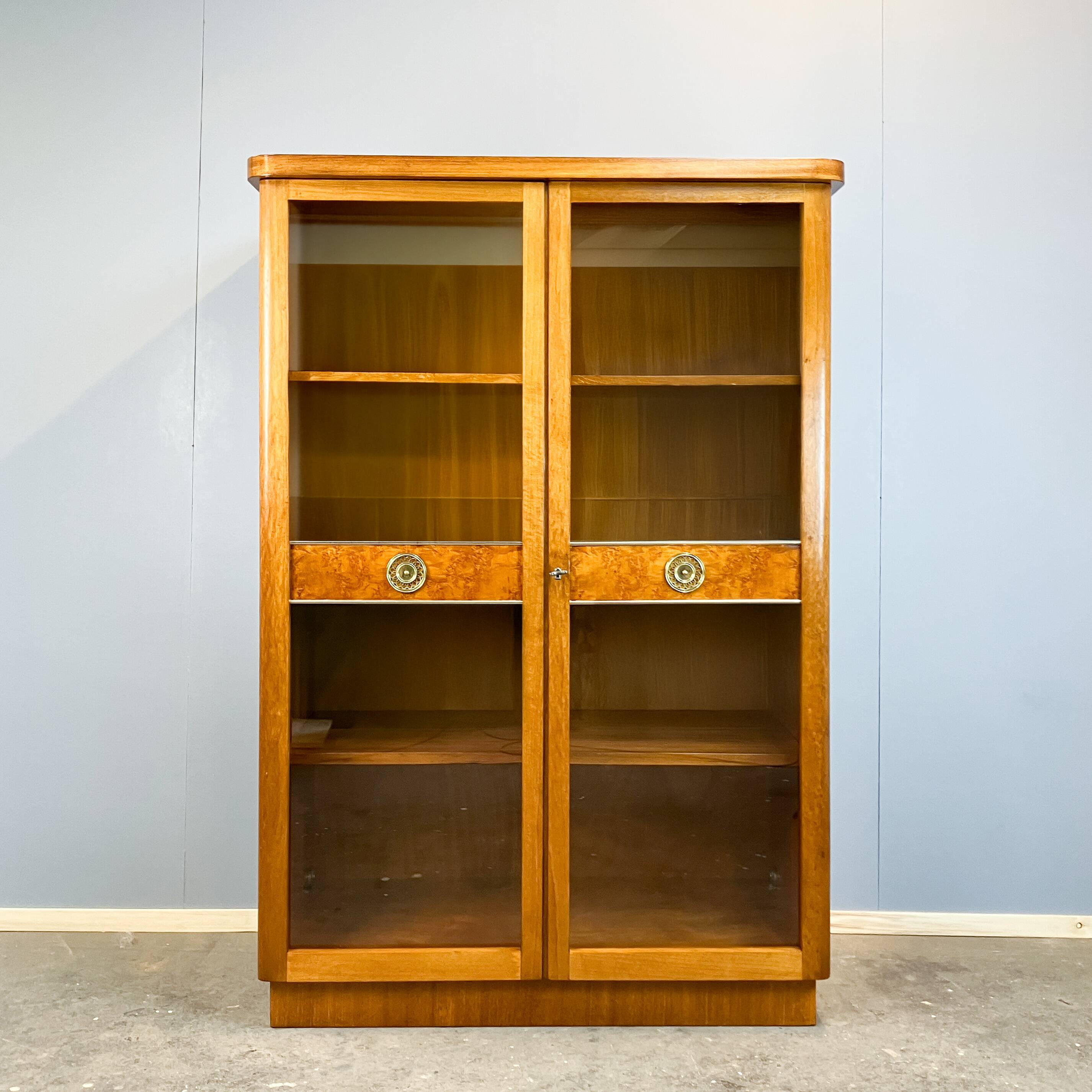 Art Deco cabinet with glass doors, various woods, 1930s