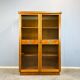 Art Deco cabinet with glass doors, various woods, 1930s