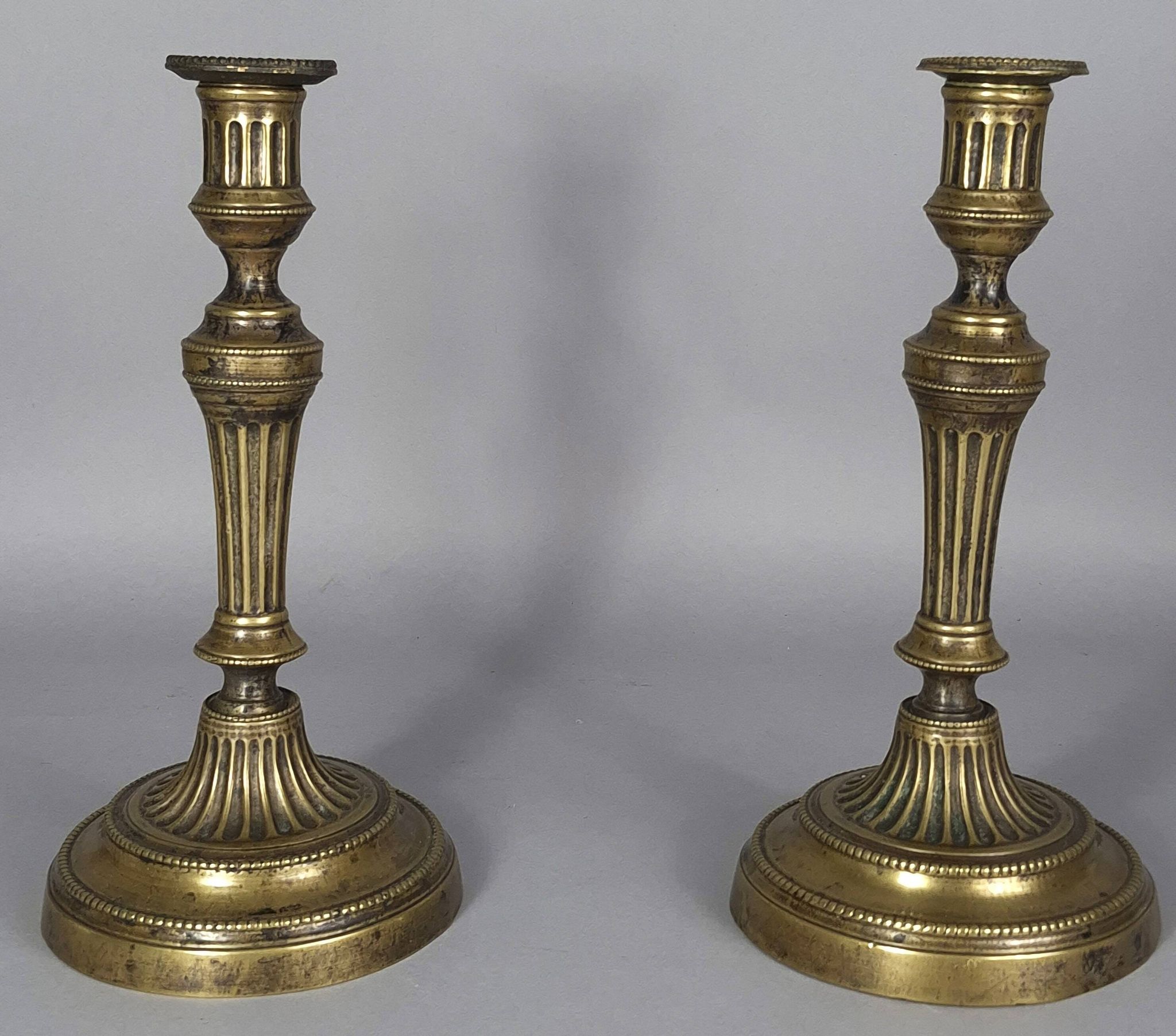 Pair of fluted bronze candlesticks Louis XVI period 27 cm