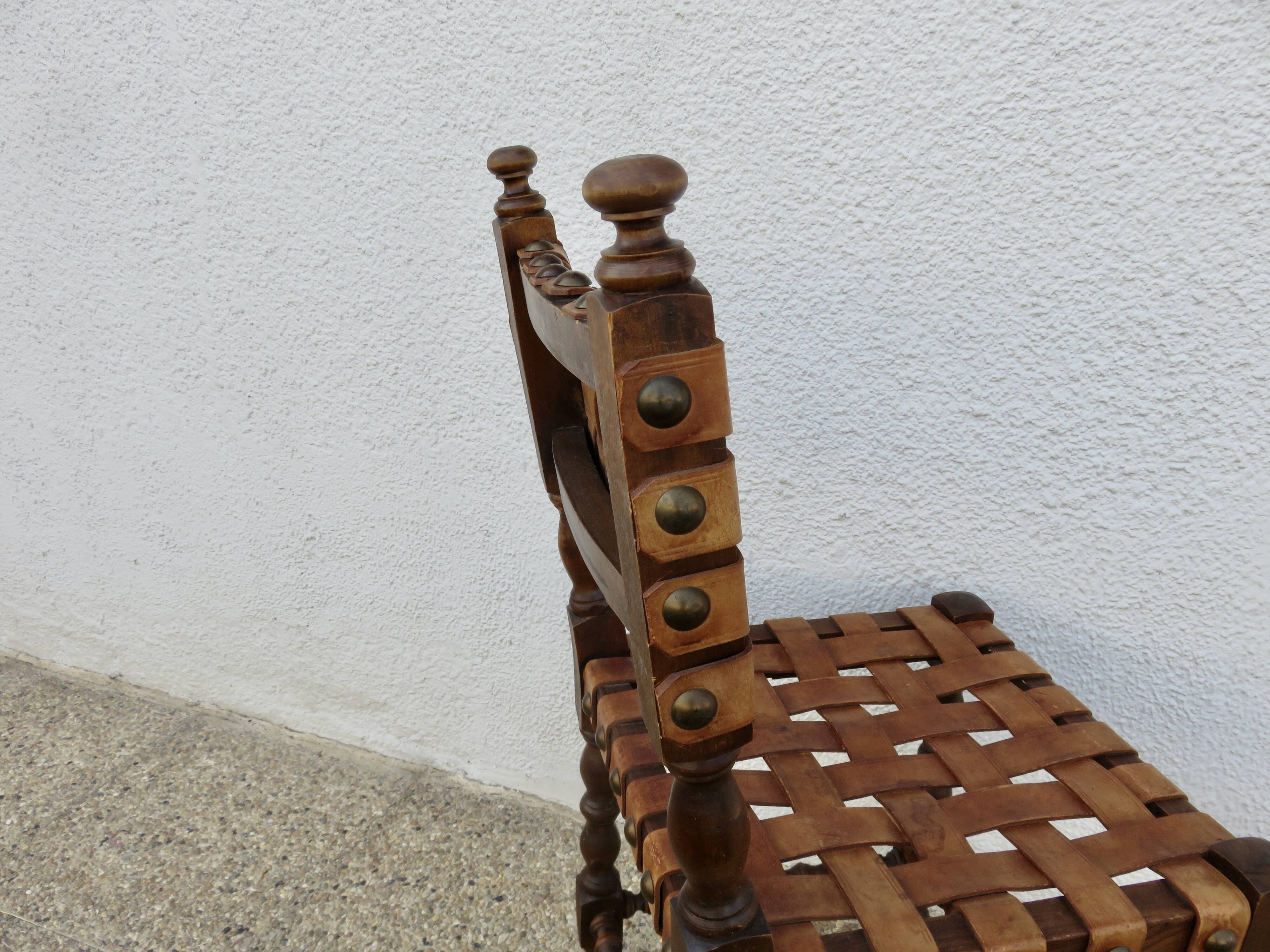 Spanish chair in oak with thick cognac leather straps, 1940s.