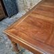 Antique French walnut table with six drawers, parquet top, early 20th century.