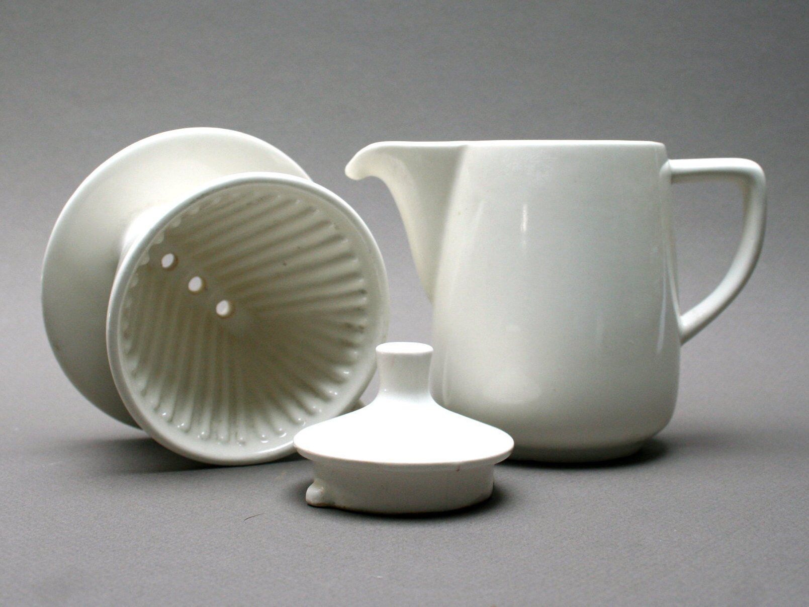 White ceramic coffeemaker and melitta filter, 60 years