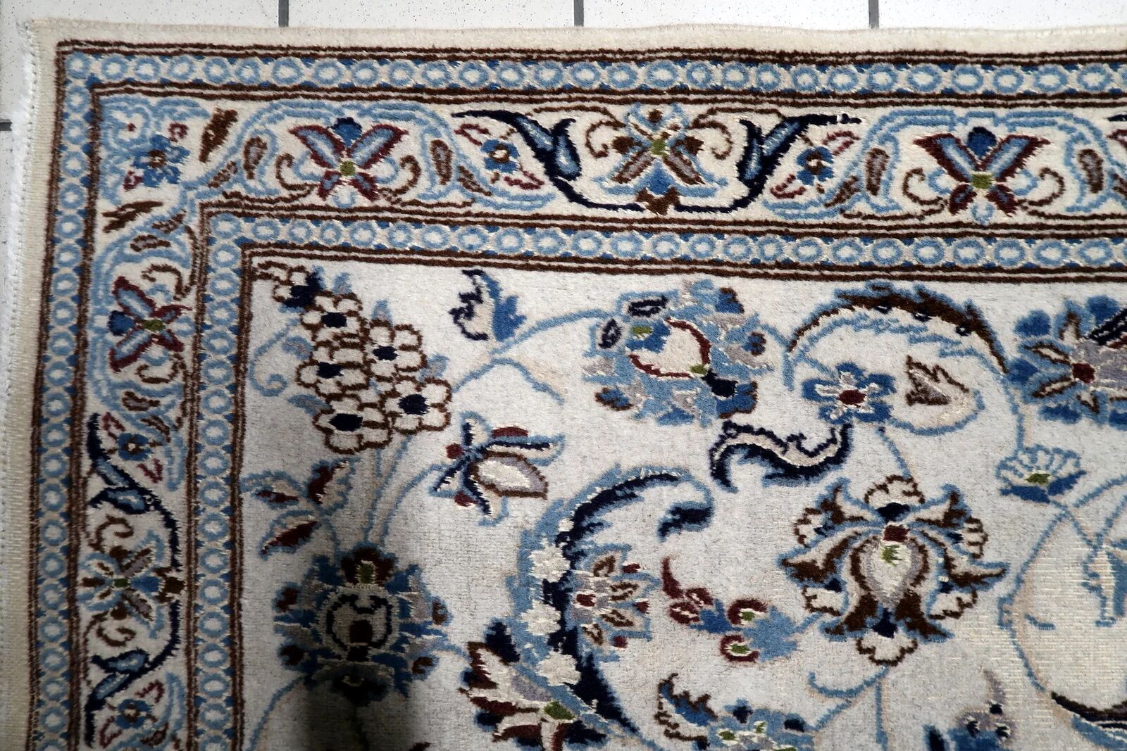 1950s hand-knotted wool rug with silk highlights, ivory and blue, 118 × 200 cm