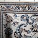 1950s hand-knotted wool rug with silk highlights, ivory and blue, 118 × 200 cm