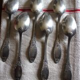 A set of 6 silver-plated metal soup spoons with foliage design.