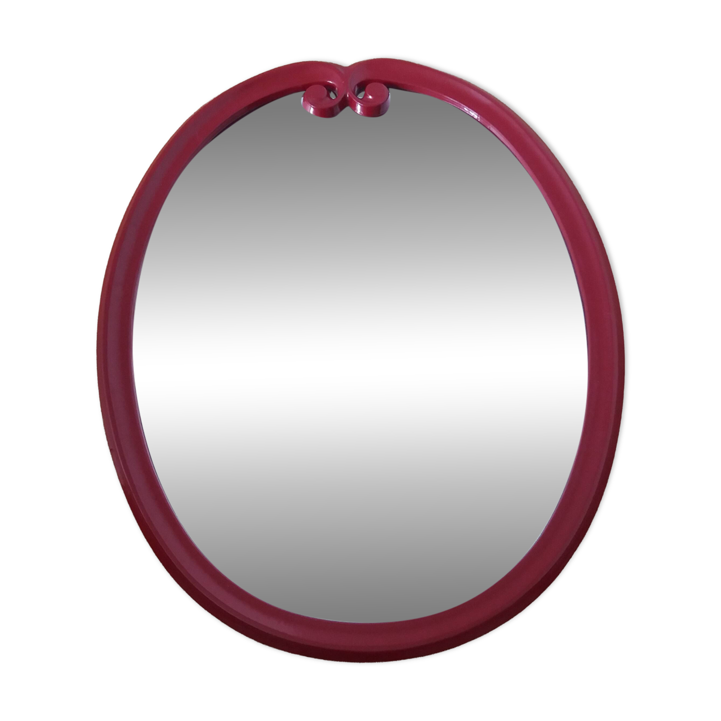 Oval mirror, red enamelled metal in Art Deco style, 49 x 39 cm.