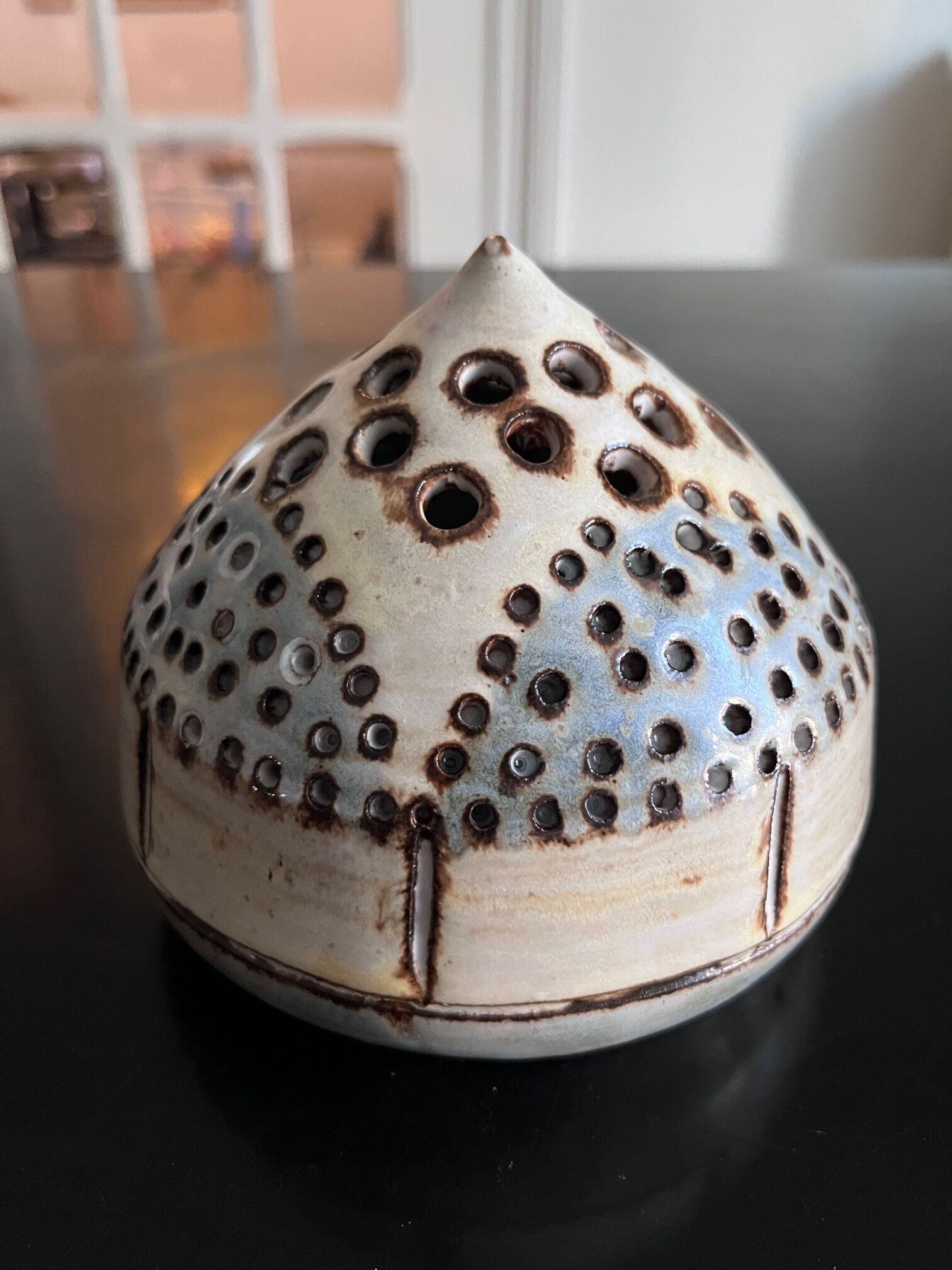 Ceramic flower pique at the old mill