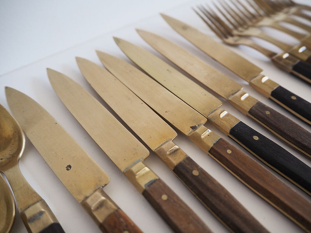 Set of old dessert cutlery in wood and brass