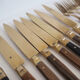 Set of old dessert cutlery in wood and brass