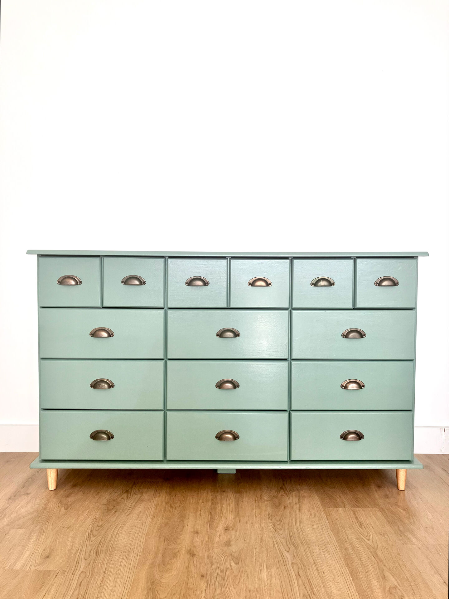 Low buffet with patinated gold handles.