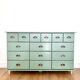 Low buffet with patinated gold handles.