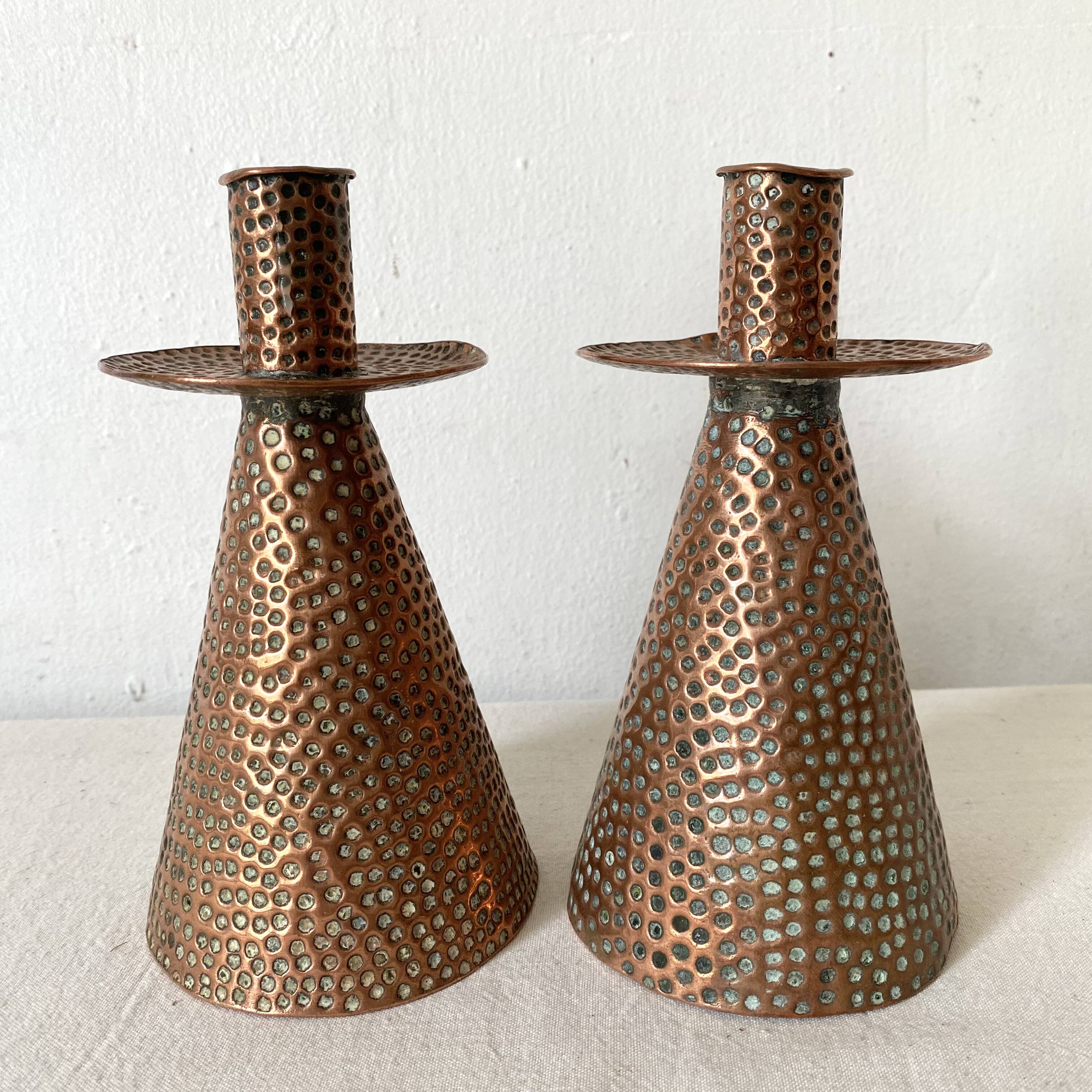 Pair of hammered copper candlesticks from the 1950s