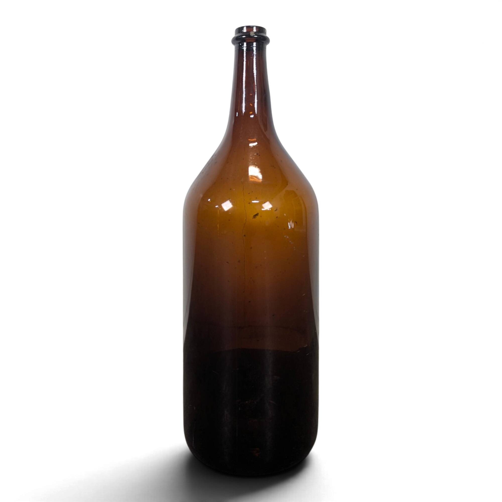 Large antique blown amber glass bottle