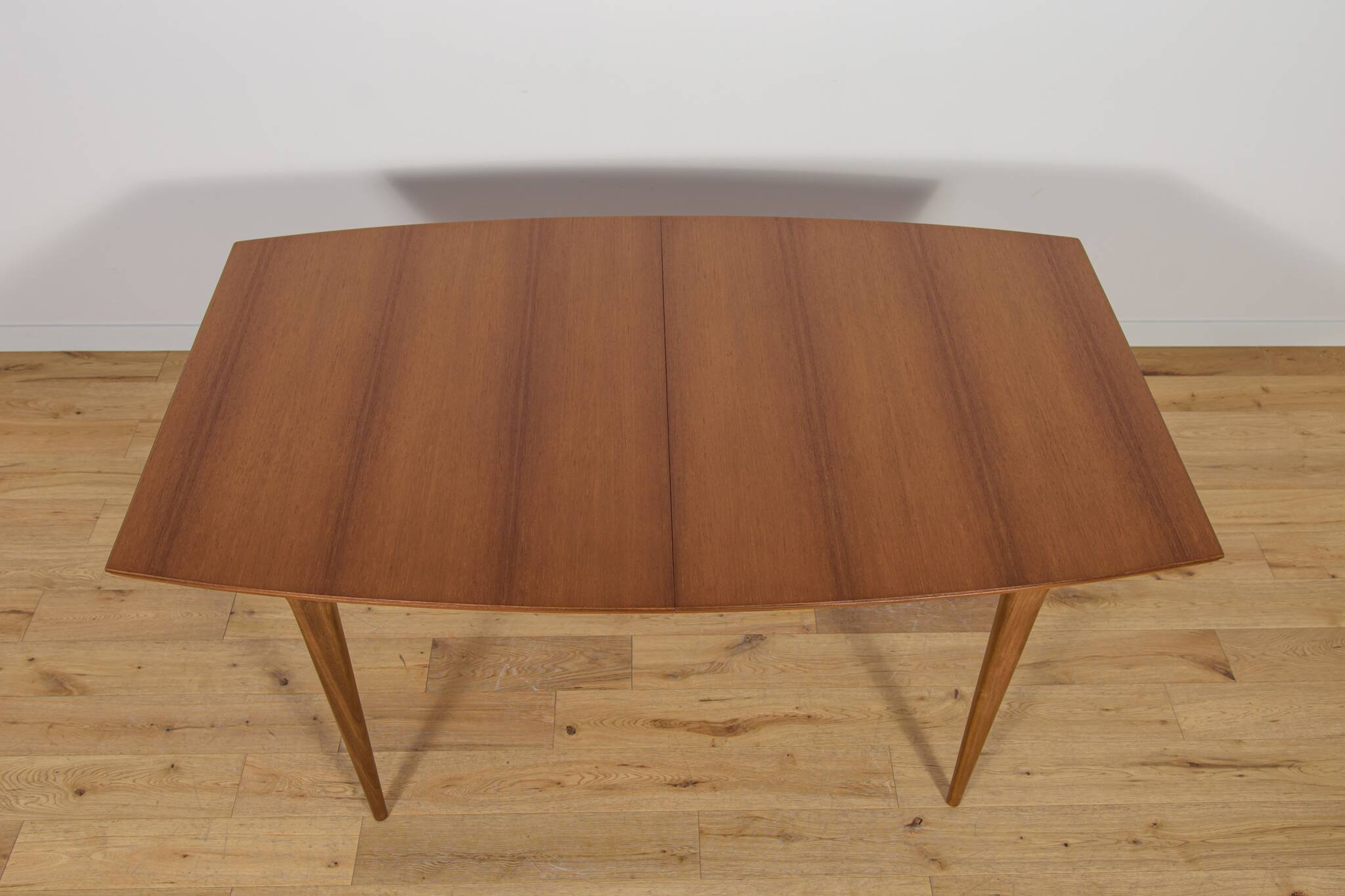 Mid-century teak extending dining table from McIntosh, UK.