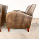 Set of two vintage leather wagon wheel armchairs Haarle