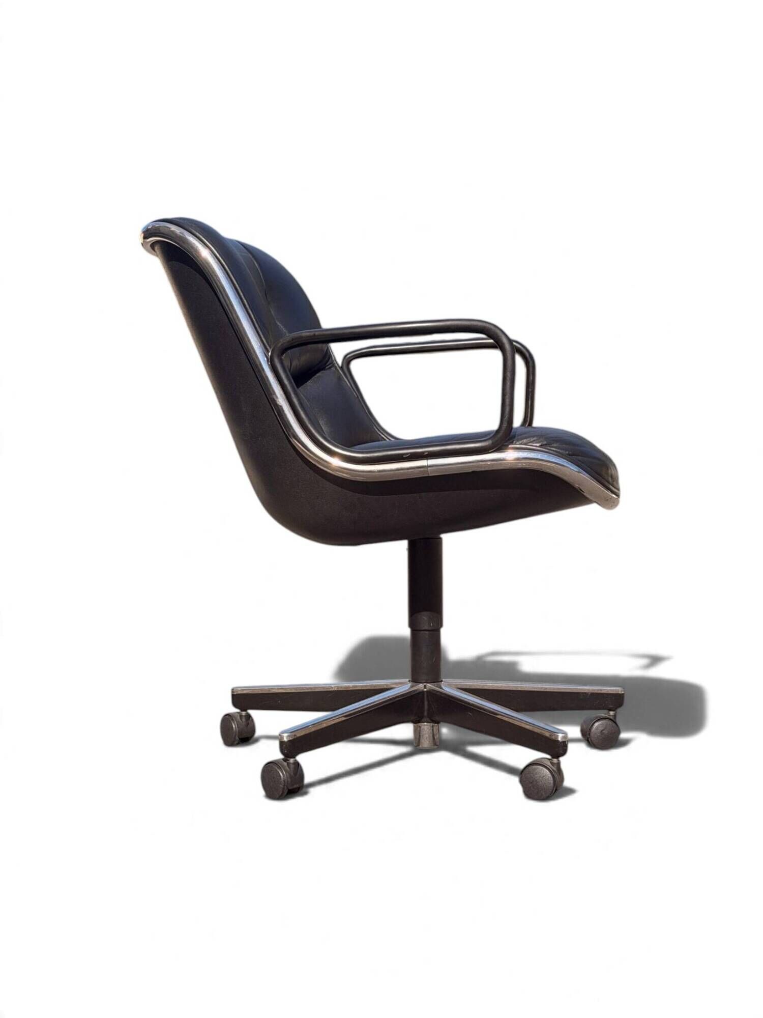 Charles Pollock Executive Knoll office chair in black leather.