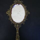 Hand-facing mirror in gilded bronze