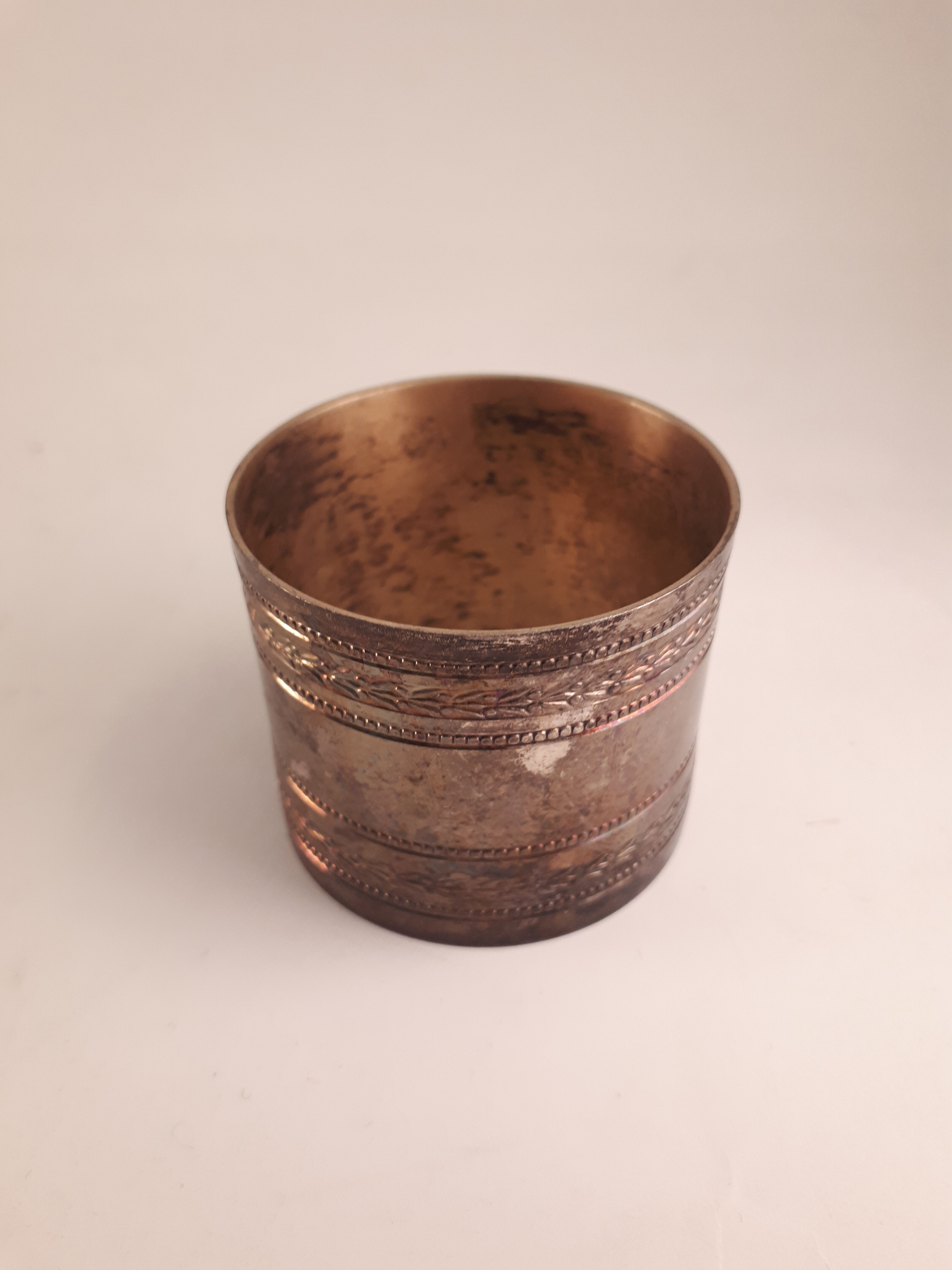 Round old silver metal towel