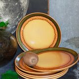 Six vintage stoneware plates with green net