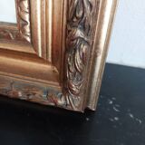 Miroir bois sculpté patine doré