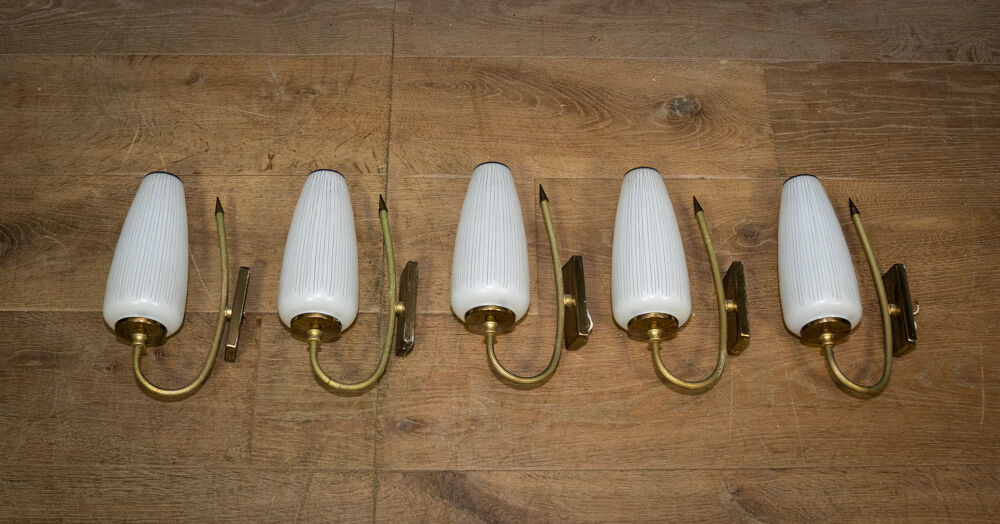 Ornate wall lamp made of milk glass and brass