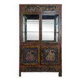 Richly carved Chinese display cabinet from the early 20th century.
