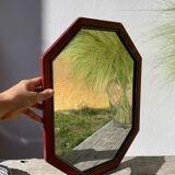 Octagonal beaded wooden mirror
