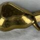 Empty pocket ashtray in pear-shaped brass