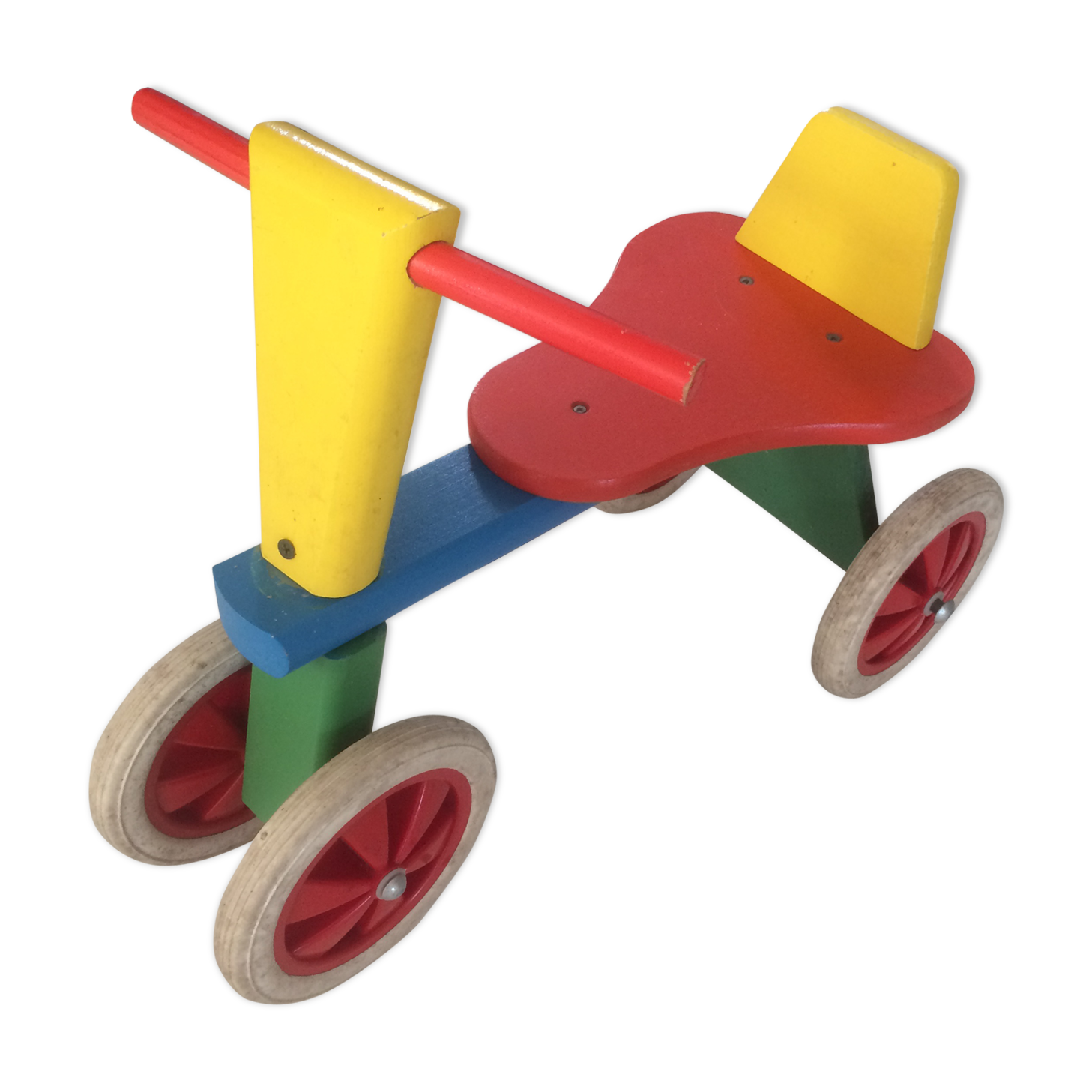 Colourful wooden 4-wheeled cycle. End of the 1970s.