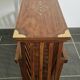 Rosewood and brass magazine stand table