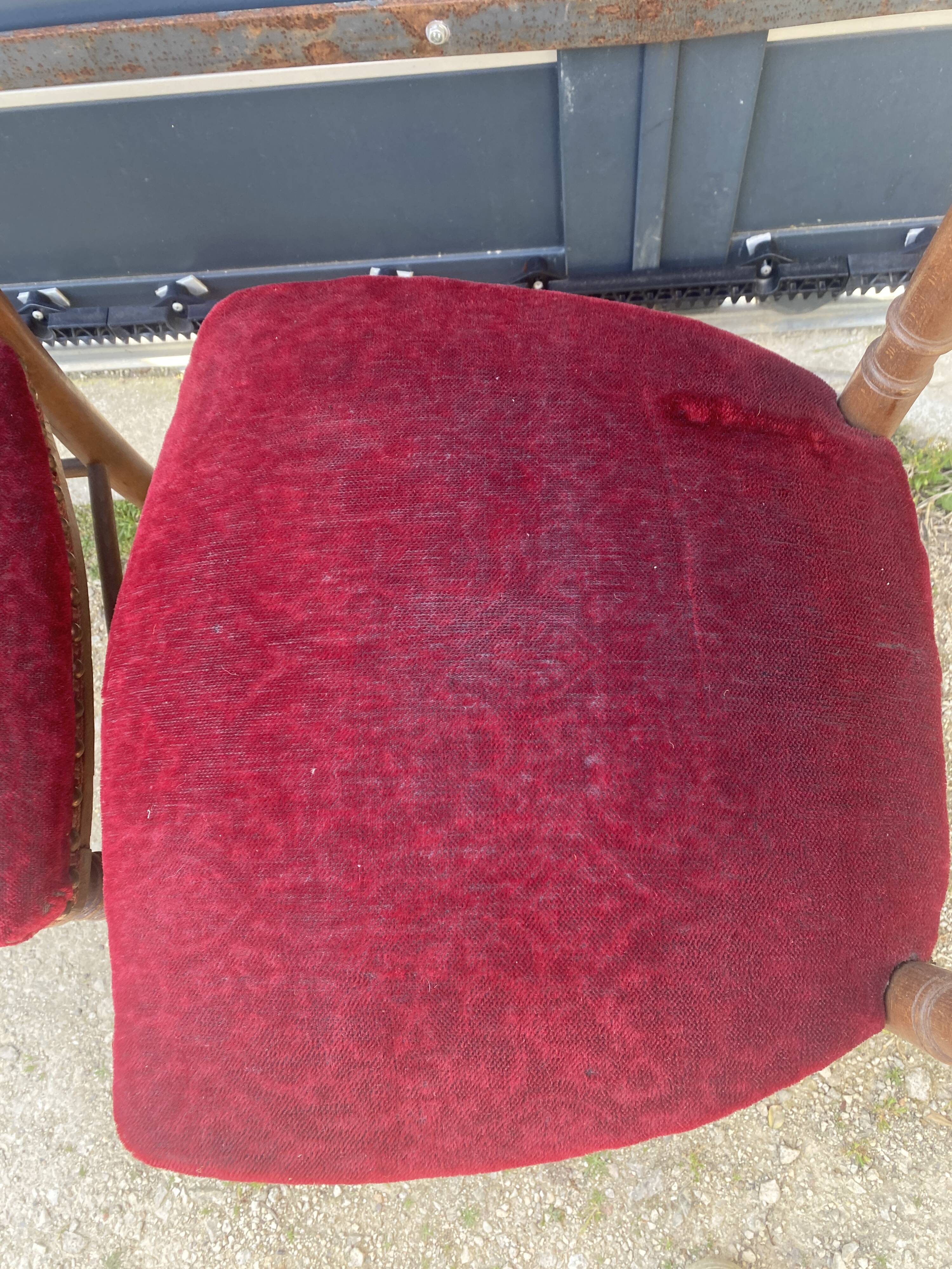 2 red velvet chairs